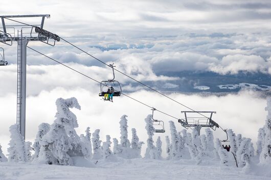 People on a chair lift at Big White Mountain