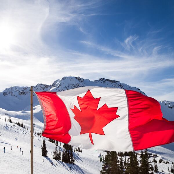 Canadian flag flying at the top of the Rendezvous on top of Whistler Mountain.