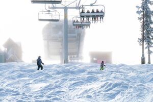 Skiers ride on Dercum in the snow in Keystone, CO.