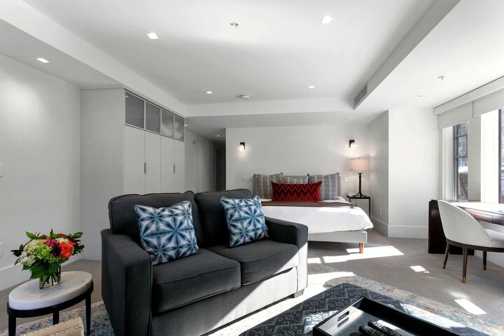 Deluxe Hotel Room Living Area & Sleeping Area