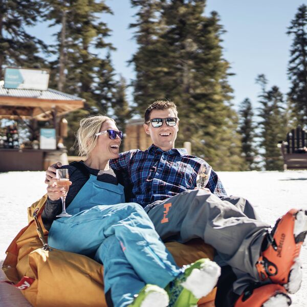 Couple Enjoys a Glass of Champagne at Tōst at Northstar California 