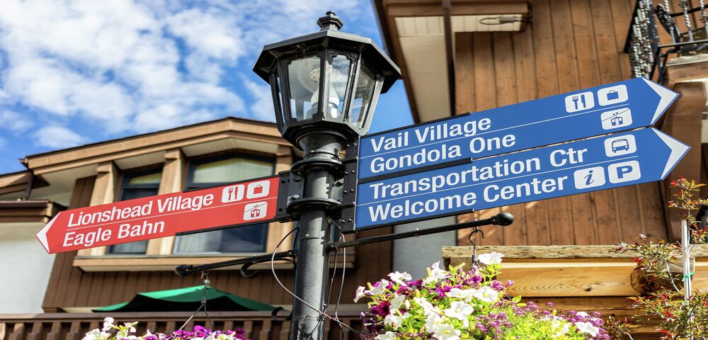 Directional sign in village