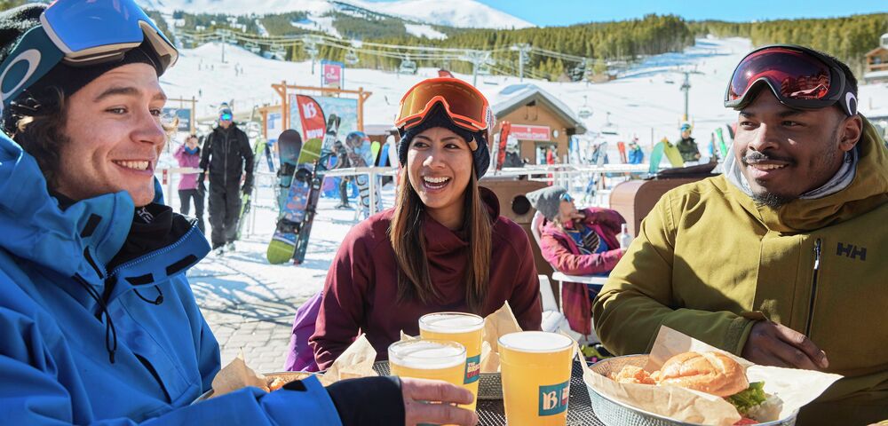 Friends enjoying food and drinks after skiing at Breckenridge, CO. 