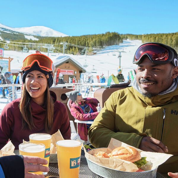 Friends enjoying food and drinks after skiing at Breckenridge, CO. 